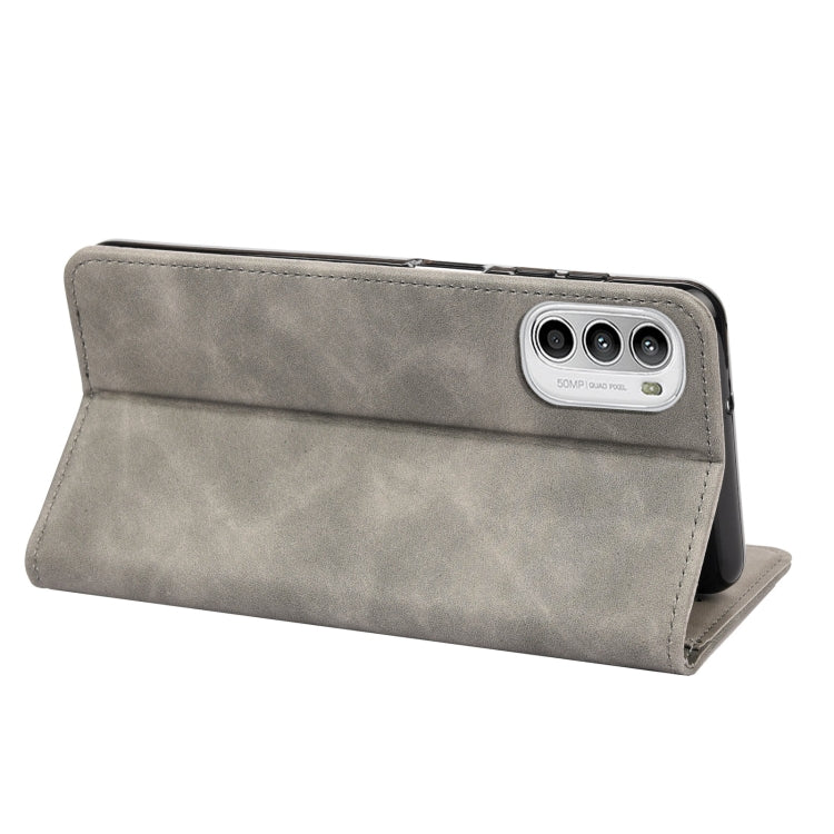 Grey leather folio phone case with camera cutout and flip cover