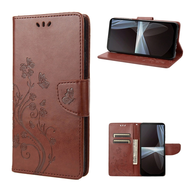 Brown embossed butterfly flip leather phone case, front and open view with stand