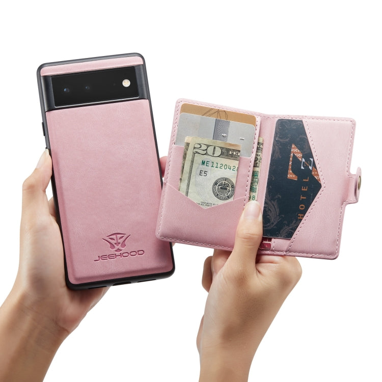 Magnetic detachable phone case, pink leather-style wallet detached from phone in hands