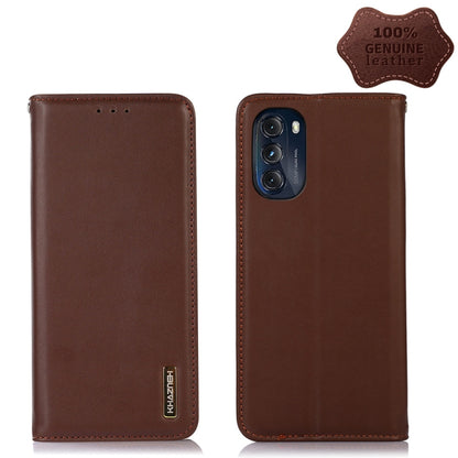 Brown leather phone case with camera cutout, stitched edges, and vertical side logo label