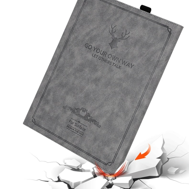 Grey tablet leather folio case with deer head emblem and decorative bottom graphic