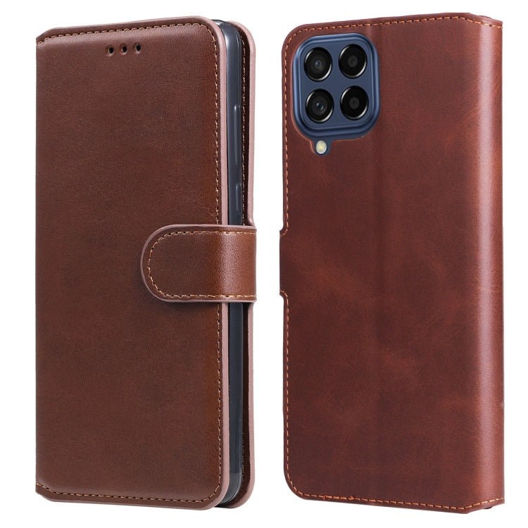 Brown leather flip phone case with side strap and four-camera back opening.