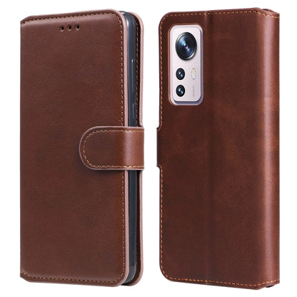 Brown leather flip phone case with side strap and single camera window.
