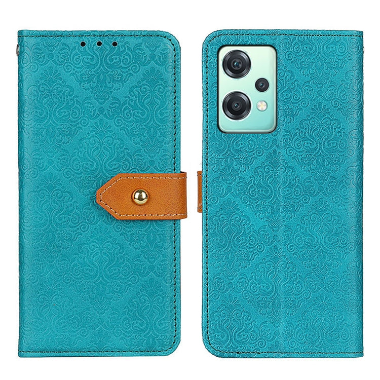 Teal embossed floral flip phone case with brown clasp and cutout for dual cameras