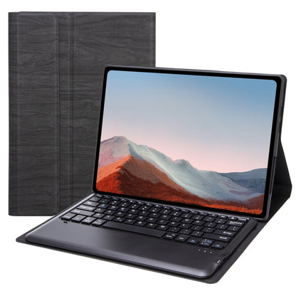 Dark gray leather tablet case with built-in Bluetooth keyboard, tablet open