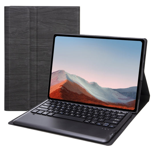 Dark gray leather tablet case with built-in Bluetooth keyboard, tablet open