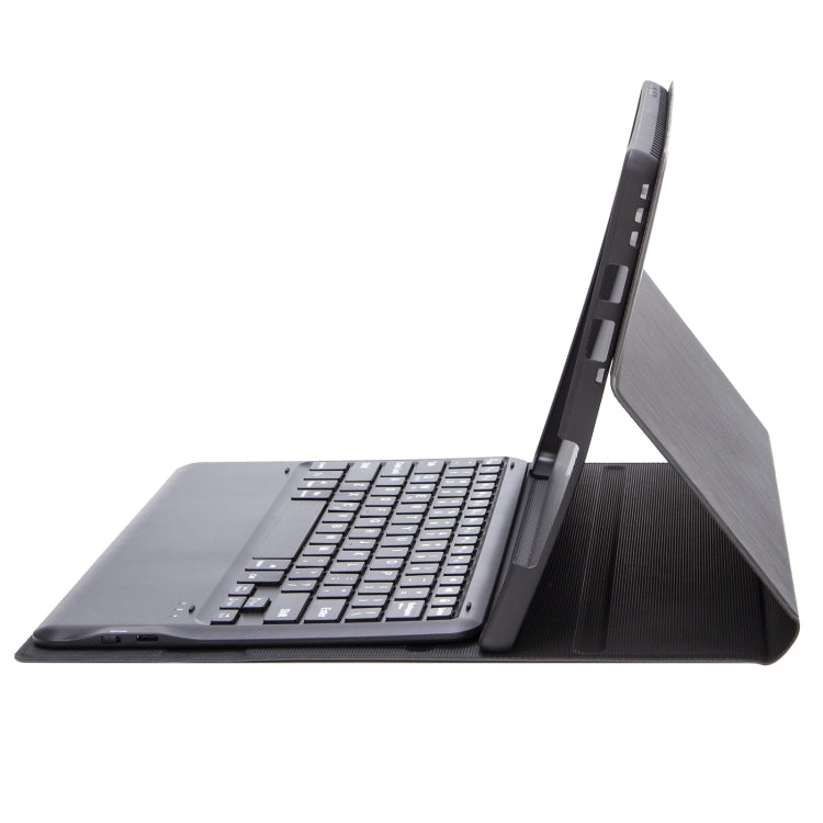 Dark gray folio stand for tablet with built-in keyboard, angled view