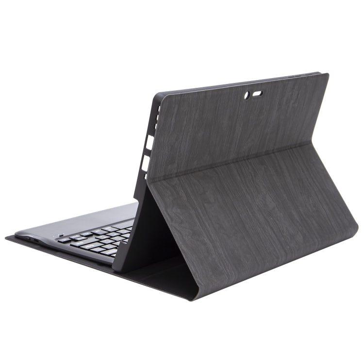 Dark gray textured leather tablet case with two top cutouts, stand flipped