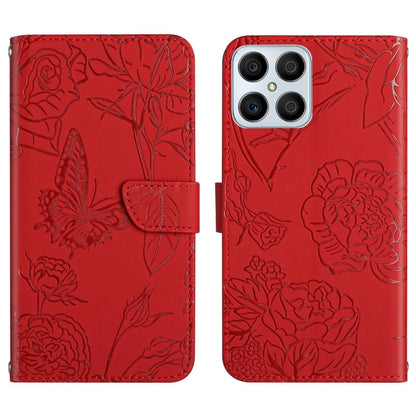Red embossed leather folio phone case with floral butterfly pattern and camera cutouts