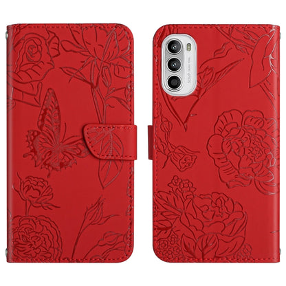 Red embossed leather folio phone case with floral butterfly pattern, side button openings