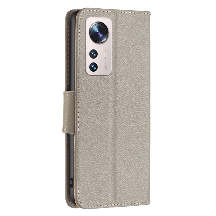 Grey leather folio phone case with camera cutout and side button openings