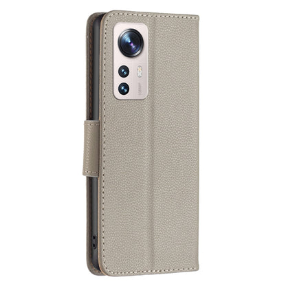 Grey leather folio phone case with camera cutout and side button openings