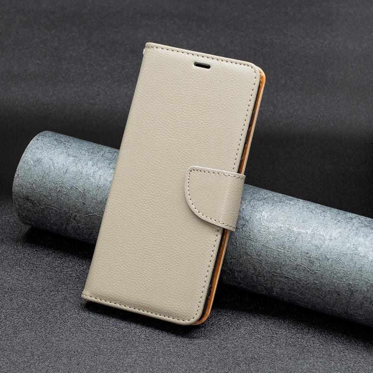 Light beige leather folio phone case with front flap and stitched snap closure