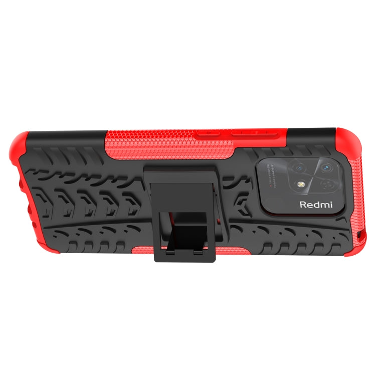 Black tire-texture phone case with red rim, kickstand holder, and camera cutout