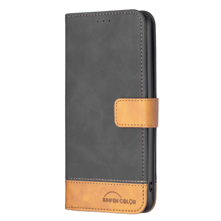 Leather phone wallet case, dark gray with tan strap and bottom pocket panel.