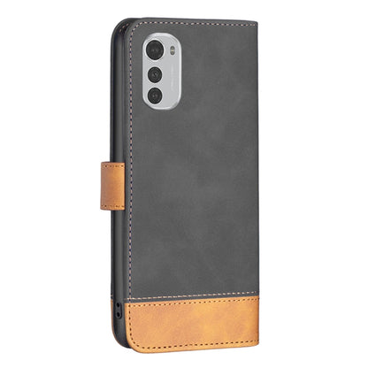 Leather phone case back, dark gray with tan bottom band and camera cutout.