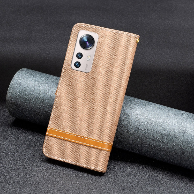 Tan textured folio phone case with camera cutout and stitched wrist strap band