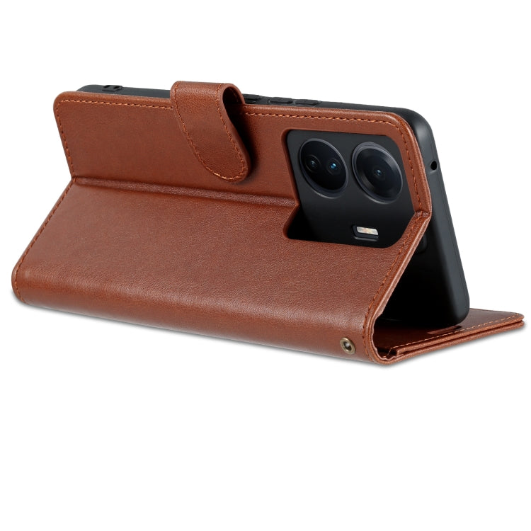 Brown flip phone case with fold-out stand and camera cutout protection.