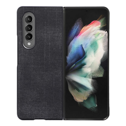Black shockproof phone case with textured finish and triple camera cutout