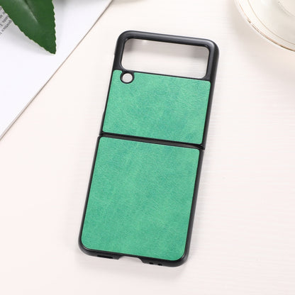 Two-piece green textured phone case with black frame and camera cutout.