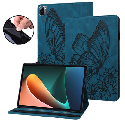 Blue embossed butterfly leather tablet folio case holding tablet on stand