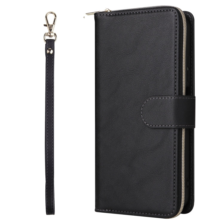 Black leather wallet phone case with snap strap and wrist lanyard, zipper closure.