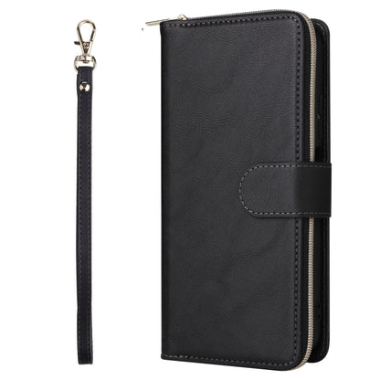 Black leather wallet phone case with snap strap and wrist lanyard, zipper closure.