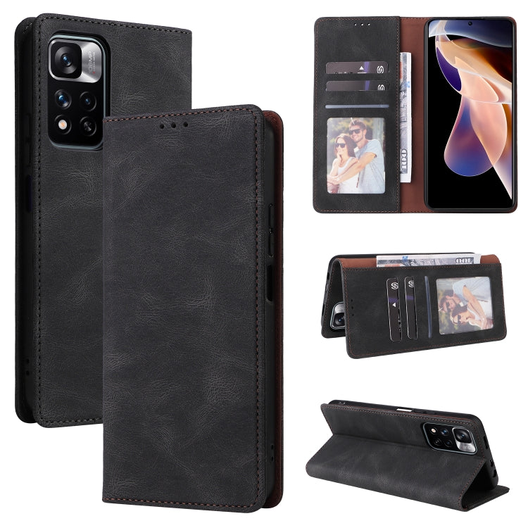 Black leather flip phone case with card slots and suction closure, open with internal pockets