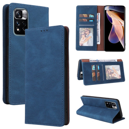 Blue leather folio phone case with card slots and suction closure, closed with camera cutouts