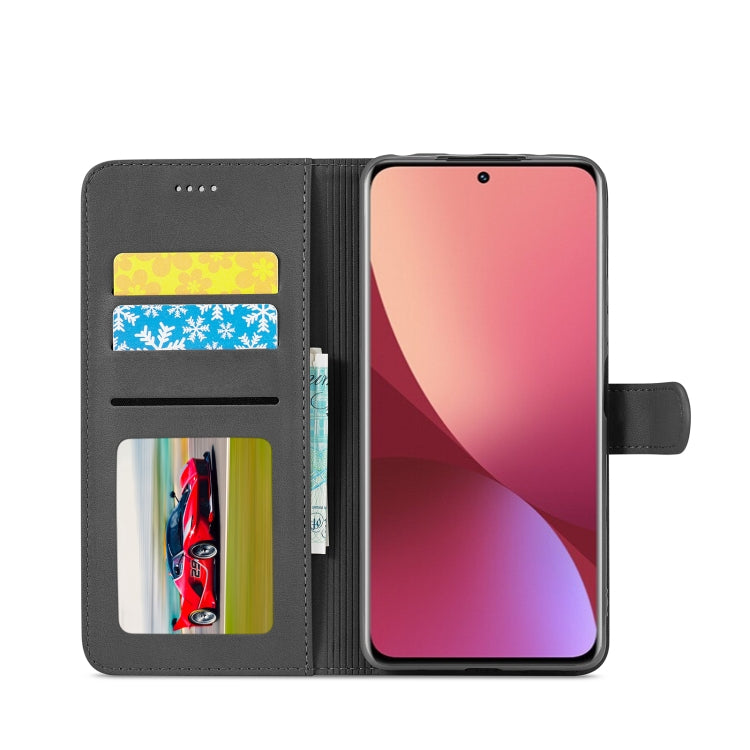 Gray flip leather phone case with card slots and stand cover, showing phone screen; dark gray