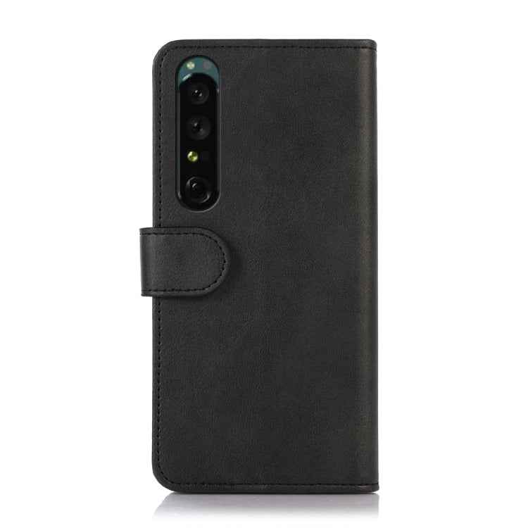 Black leather wallet phone case with camera cutout and side strap