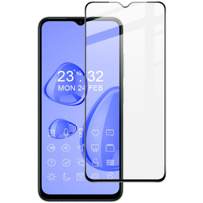 Tempered glass screen protector film covering smartphone display, rounded corner edges