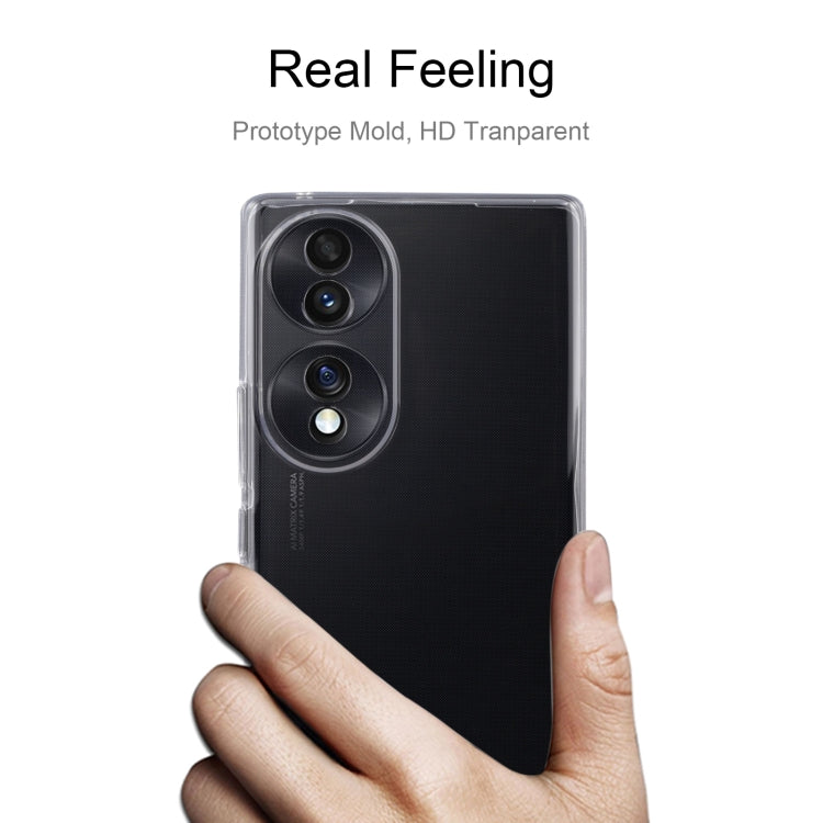 Clear TPU phone case held in hand, covering phone back and camera area