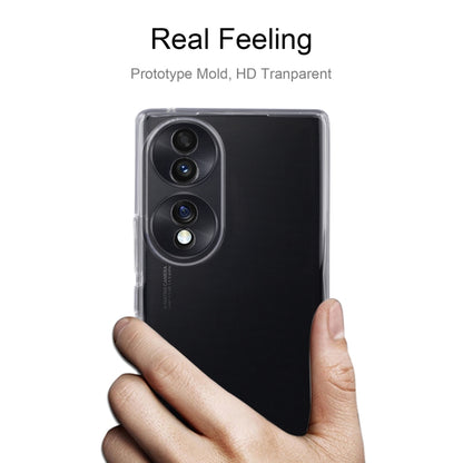 Clear TPU phone case held in hand, covering phone back and camera area