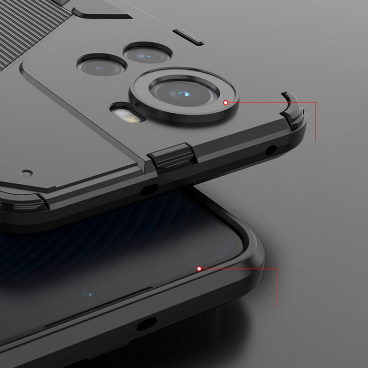 Armored phone case with raised lens protection and side grip ridges