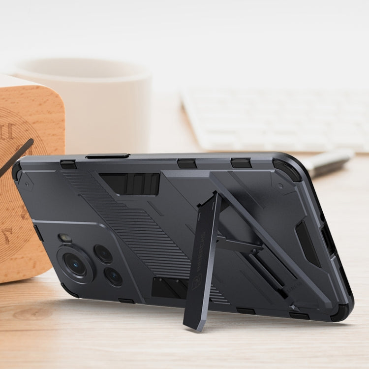 Black phone case with built-in stand and rugged bumper corners