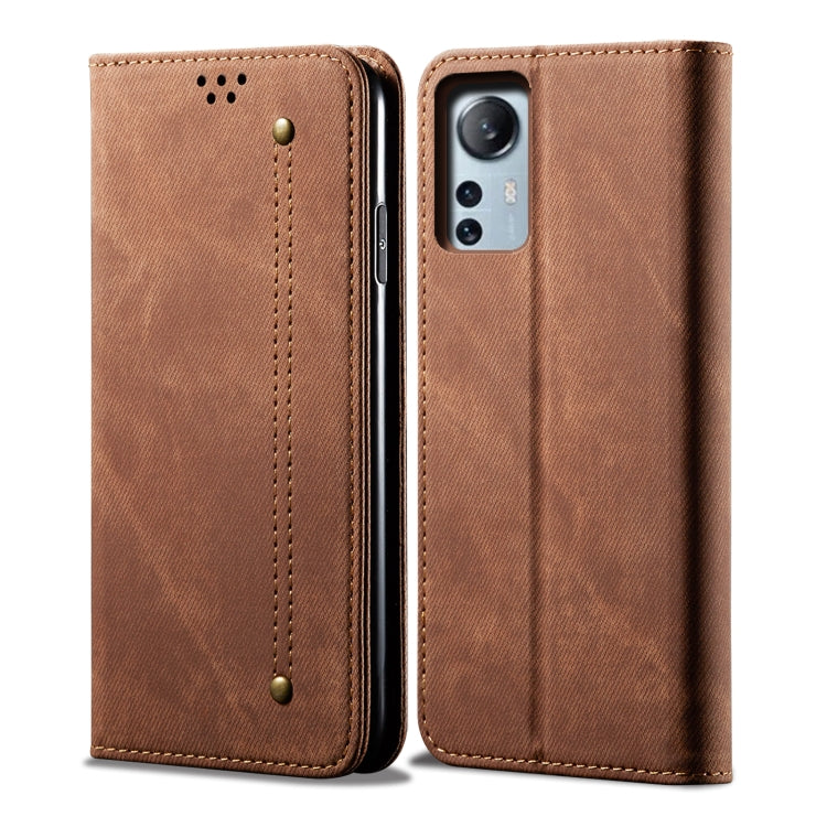 Brown denim-textured leather phone case with camera cutout and card slot.