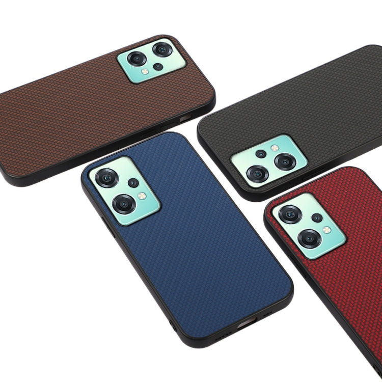 Carbon-fiber phone case in brown, blue, black, and red with camera cutouts