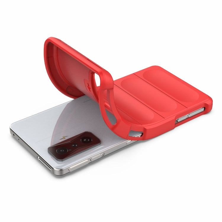 Red TPU phone case covering the back with camera cutout and raised edges