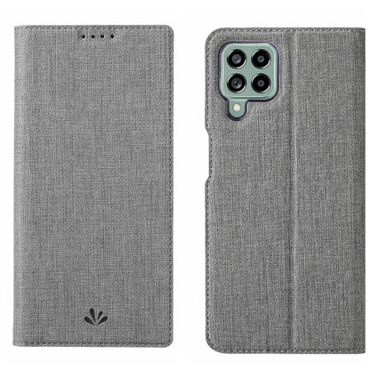 Light gray flip phone case with textured fabric and front cover opening cutouts