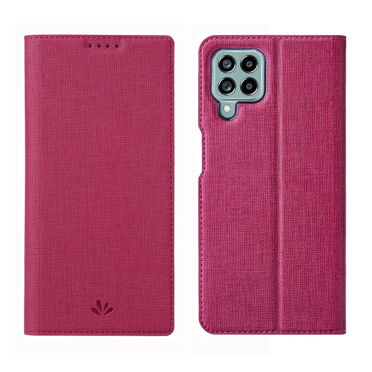Pink flip phone case with textured fabric and camera opening on the back