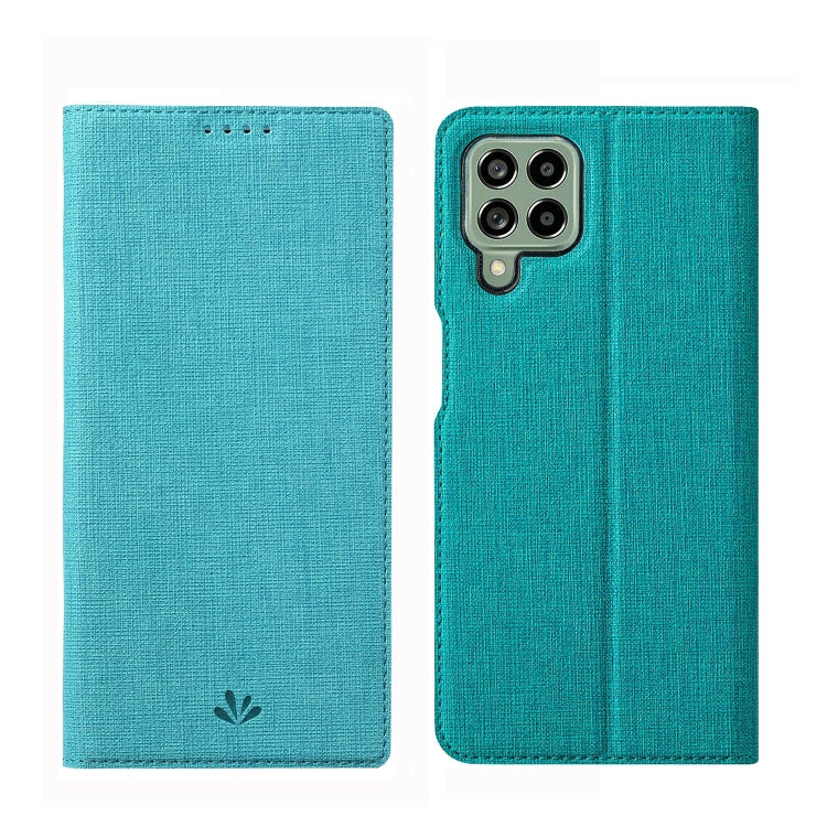 Teal flip phone case with textured fabric and cutouts for camera and ports