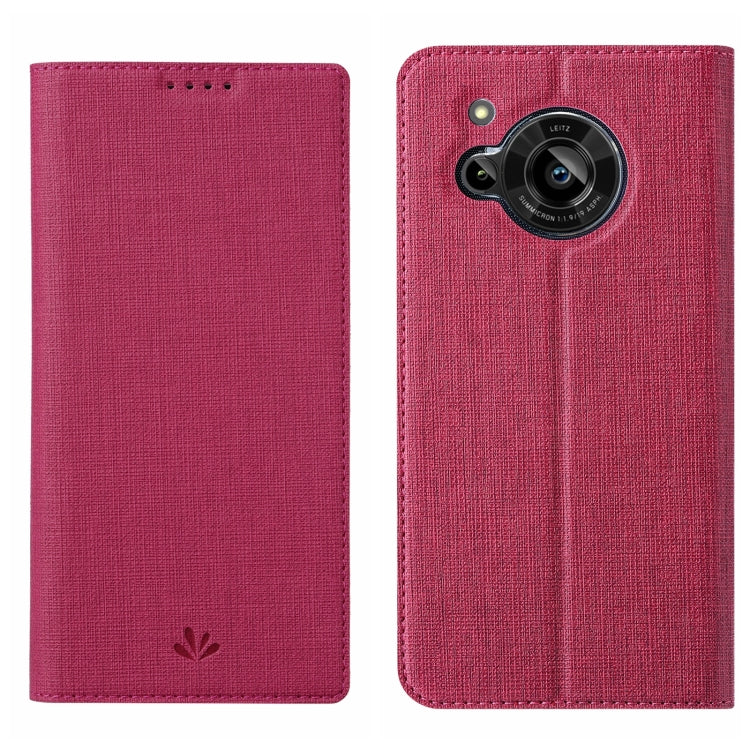 Magenta/pink flip phone case with textured fabric and camera lens opening