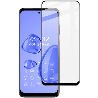 Clear tempered glass screen protector film aligned to smartphone front display