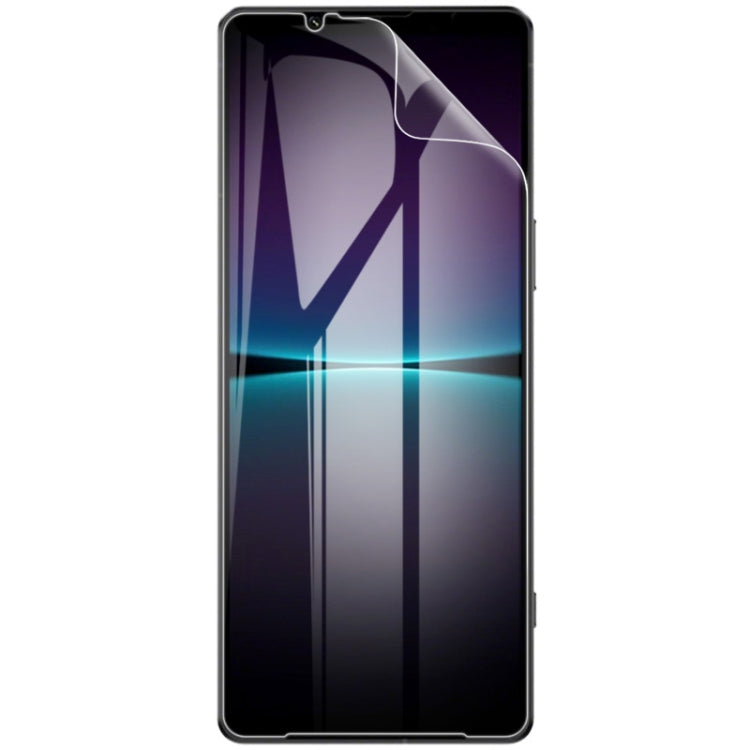 Applied curved clear hydrogel screen protector film on smartphone front, edge-to-edge.