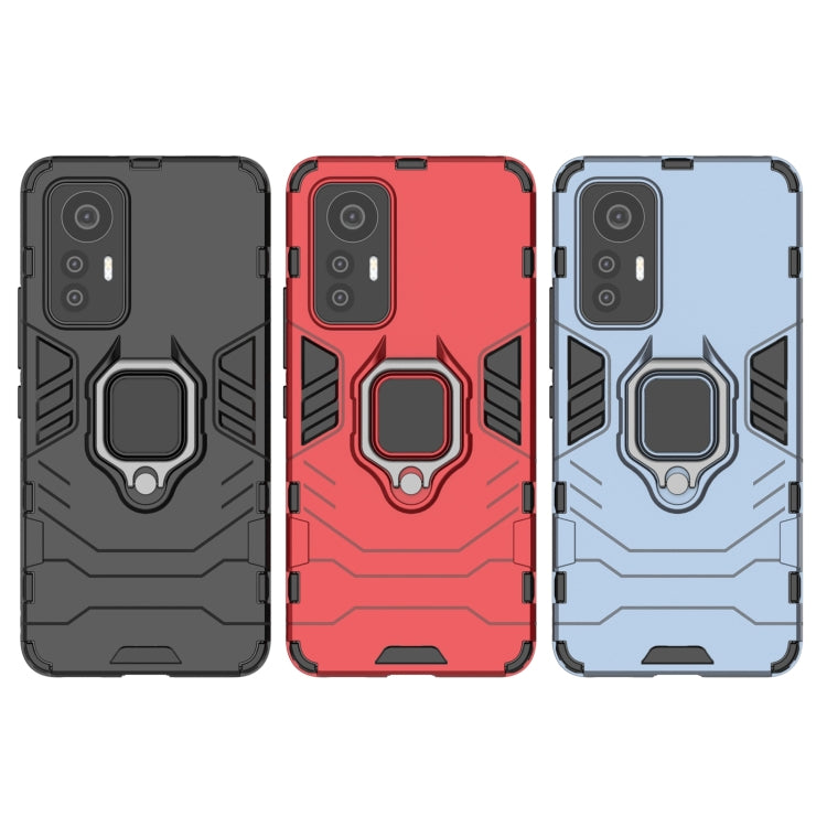 Shockproof phone case with magnetic ring holder in black, red, and navy blue