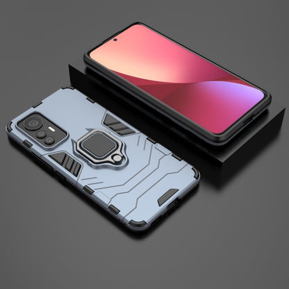 Shockproof phone case with magnetic ring holder, navy blue, angled front view