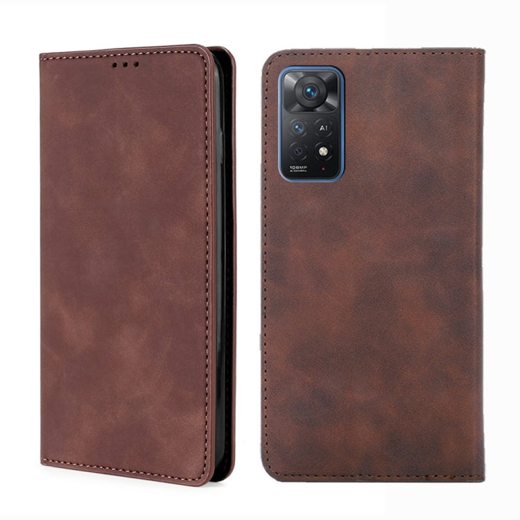 Dark brown leather flip phone case with stitched edges and camera cutout on the back shell
