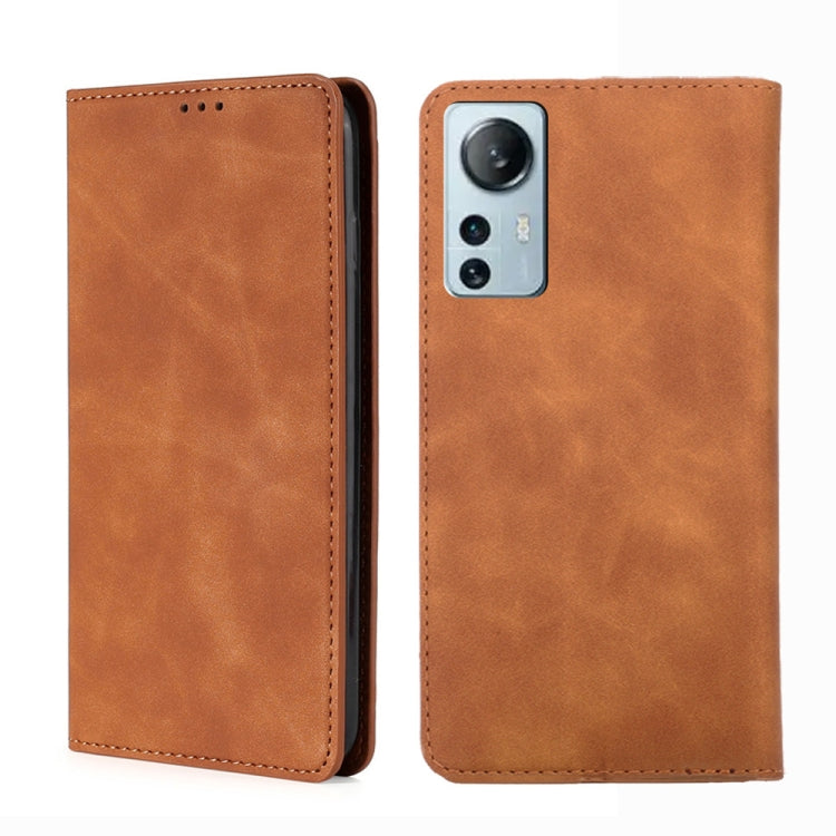 Tan leather flip phone case with stitched edges and camera cutout on the back shell