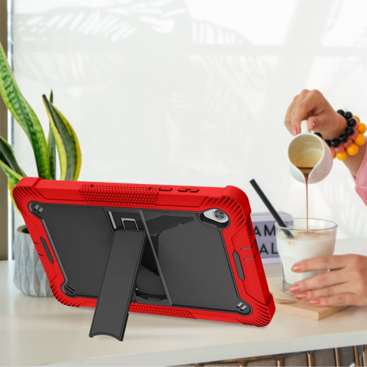 Red tablet case with kickstand angled for viewing, textured edges, and camera opening